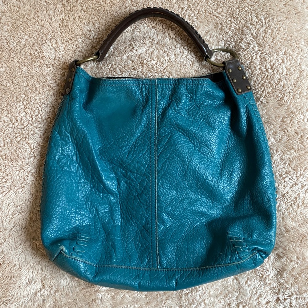 Hobo bag with braided leather strap